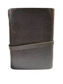 Brown leather notebook with a strap on a white background