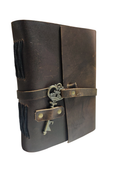 Brown leather journal with a key on a white background