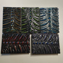 five dragon spine book covers with purple, blue, green, orange, and red patterns against a white background./