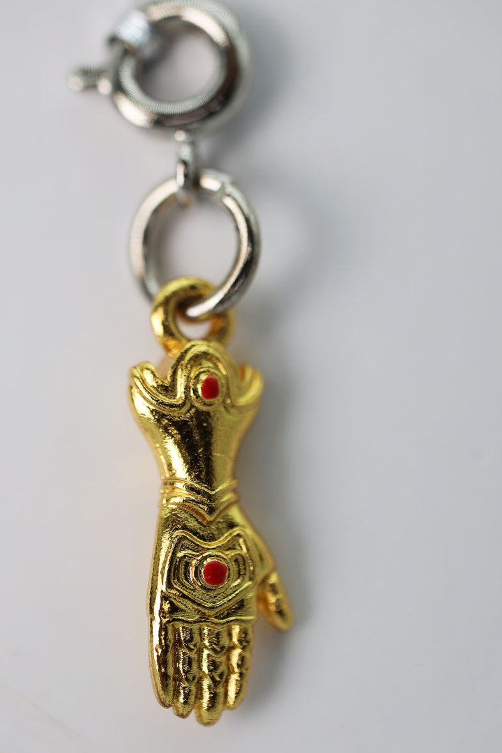 Traveler's Trinkets: Enchanted Gauntlet Charm | D20 Games