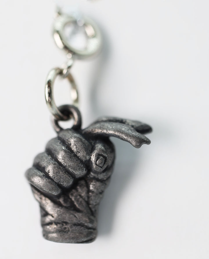 Traveler's Trinkets: Fist With Handwraps Charm | D20 Games