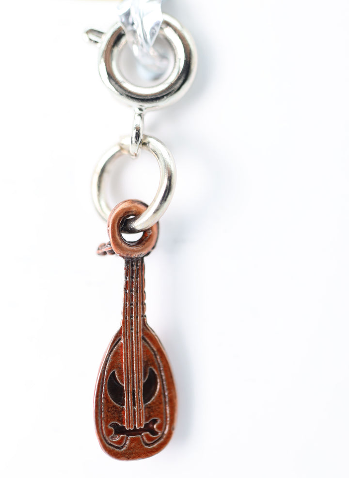 Traveler's Trinkets: Lute Charm