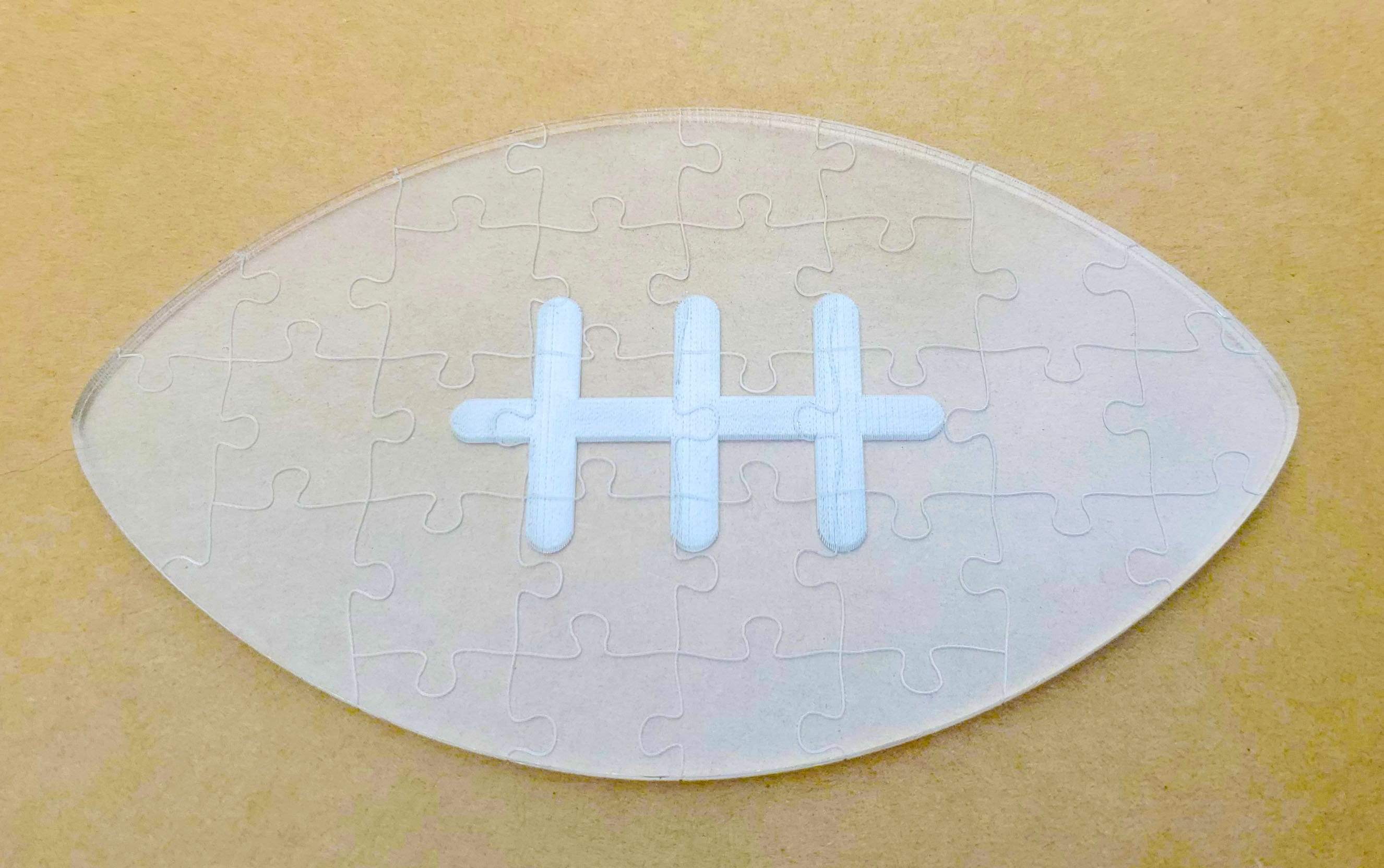 Football Shaped Laser Cut Acrylic Jigsaw Puzzle | D20 Games
